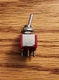 SWITCH TOGGLE, C&K Part No# 7301SYCQE, 3PDT 5A 120V, PANEL MOUNT, WIRE LUG